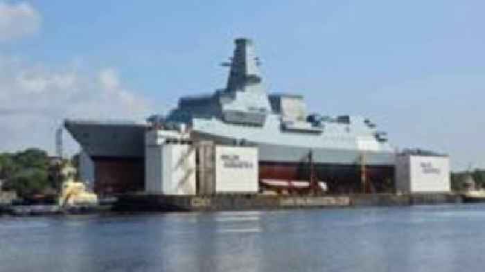 New Navy frigate makes first journey on giant barge