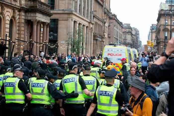 Thousands of protesters gather in George Square as police battle to keep order