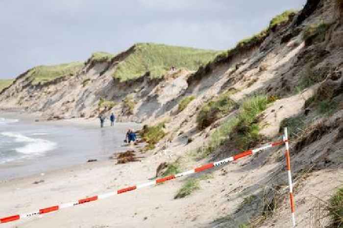 Two young boys die in beach horror after hole they were digging collapses