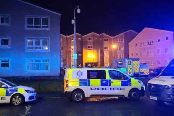 Man found dead in block of Scots flats and woman in hospital after 'disturbance'