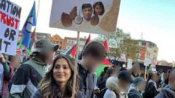 Woman cleared by court for coconut placard at rally