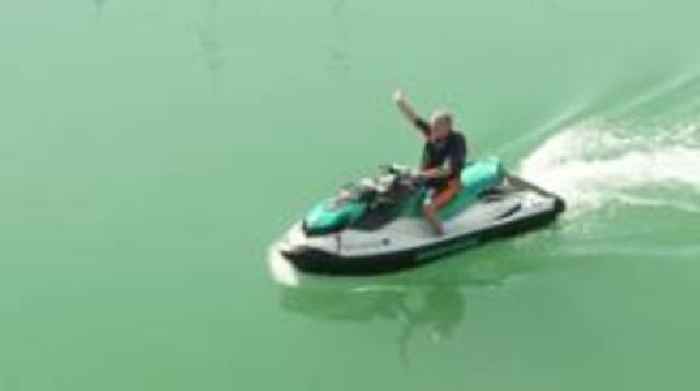 Lib Dem leader arrives at conference by jet ski