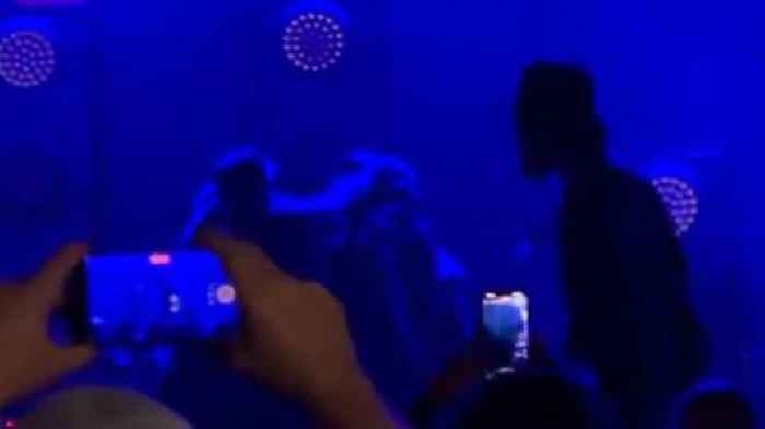 Singer punches guitarist mid-song as rock band's reunion gig ends in chaos