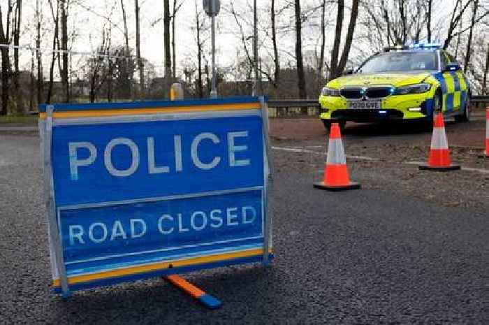 Police and paramedics scrambled as biker crash shuts road