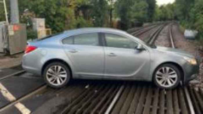 Train disruption after car blocks level crossing