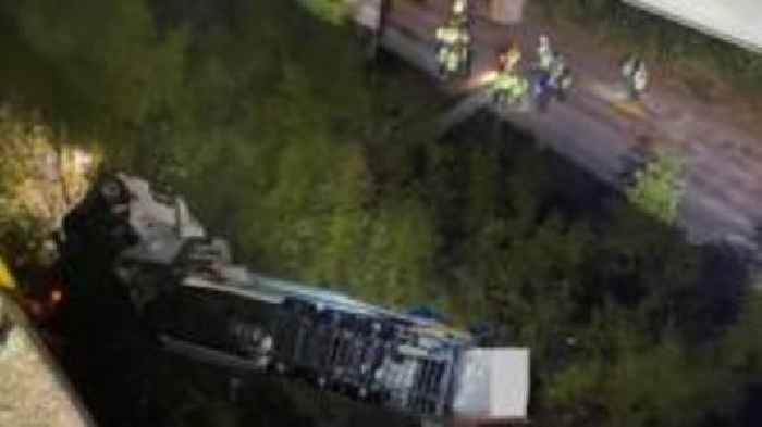 Lorry falls 60 metres from motorway bridge