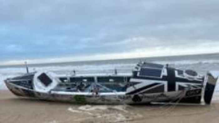 Atlantic rowing boat stranded on beach