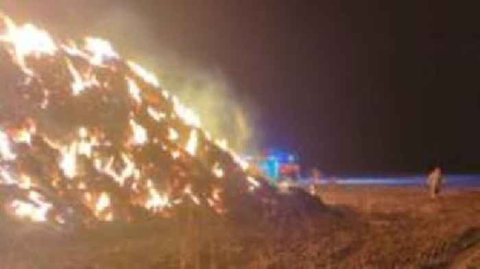 Firefighters tackle 180-tonne haystack blaze