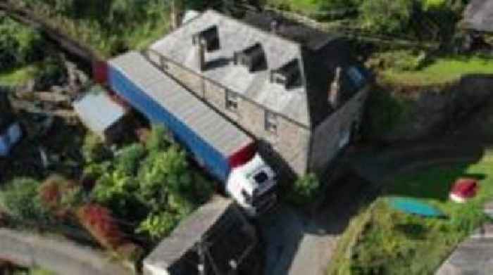 Lorry gets stuck in narrow village lane