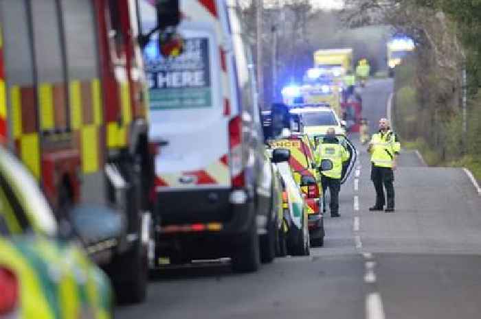 School bus containing dozens of passengers overturns as four taken to hospital