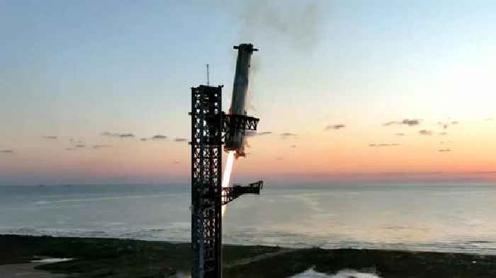 SpaceX rocket booster makes successful landing attempt after test launch - as it is caught by 'chopsticks'