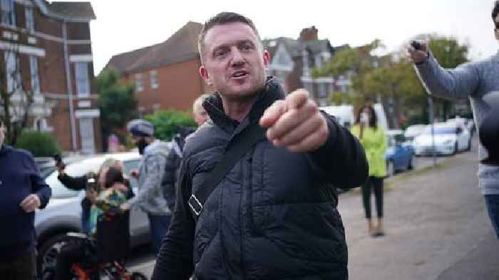 Tommy Robinson charged after handing himself in at police station