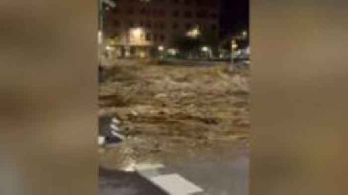 Watch first wave of flood water gushing through town in Valencia