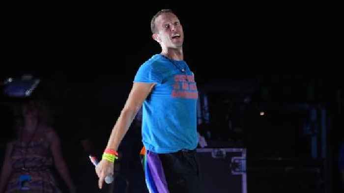 Coldplay's Chris Martin falls through stage