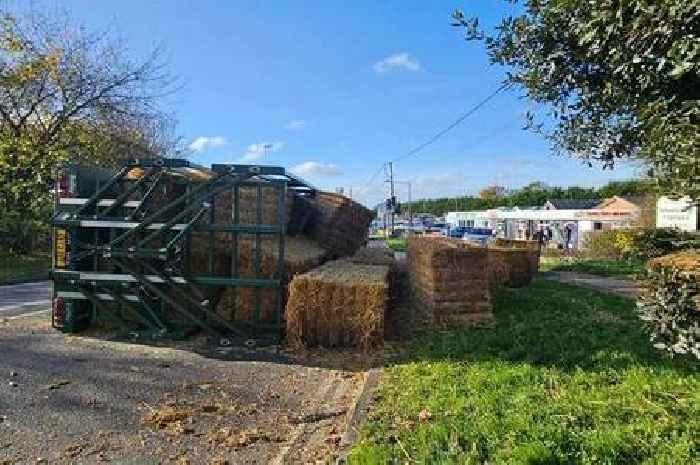 Pictures show flipped tractor that shut A120 with mess across road