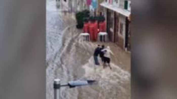 Watch: Málaga flood turns street into river