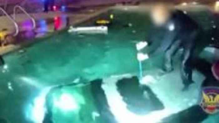 Watch: Moment police officer rescues man trapped in submerged car