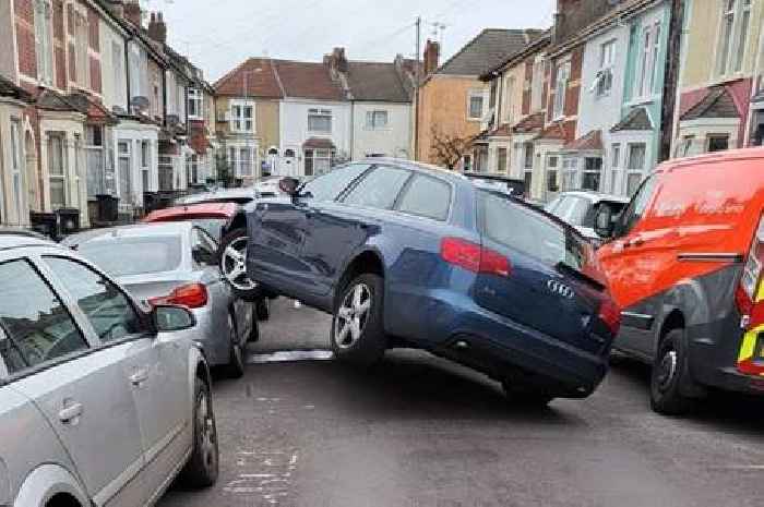 Bizarre moment Audi mounts parked car on Bristol street