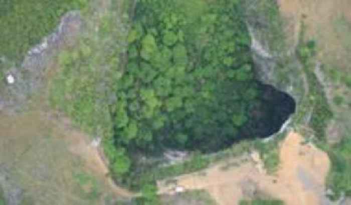 China's huge sinkholes reveal hidden treasures as viral videos draw tourists