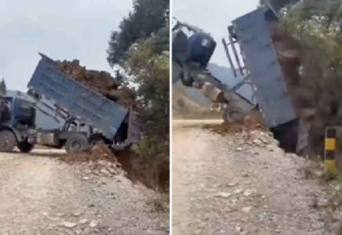 Truck Driver Unloads Dirt (And Himself) Down a Hill