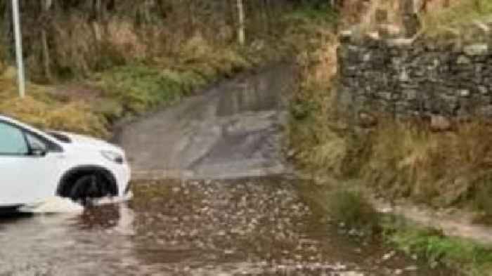 Man dies after car enters flooded ford