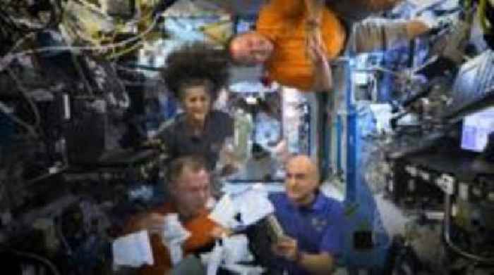 Astronauts unbox Thanksgiving meal aboard ISS