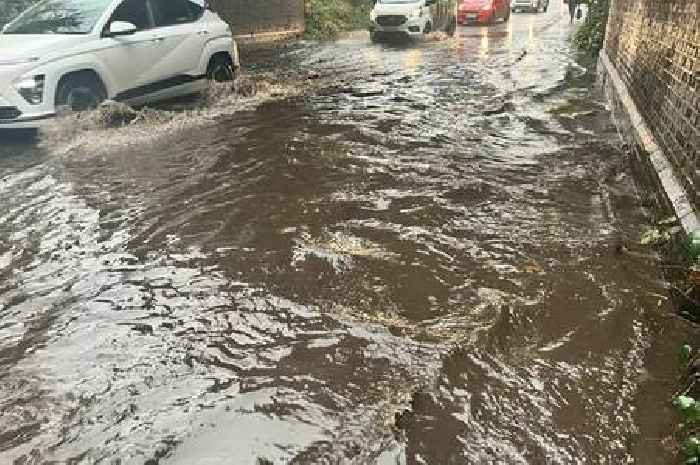 Surrey families forced to wade through 'dangerously' high levels of flood water to get to school