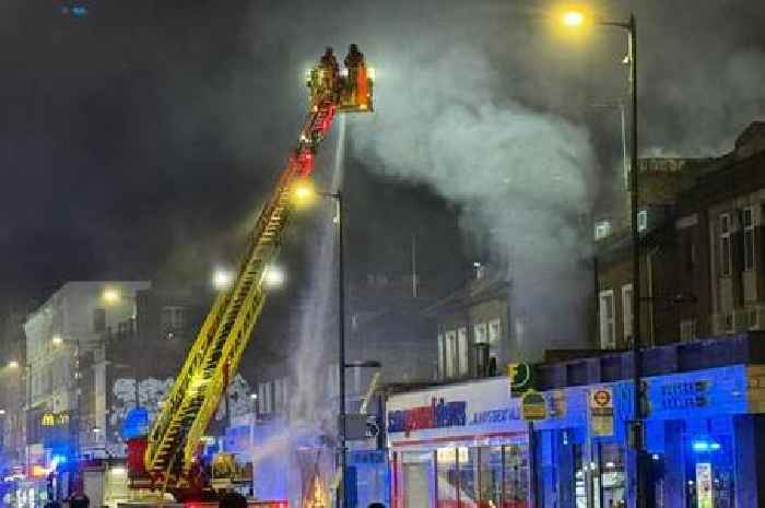 Hundred firefighters battle horror blaze at takeaway shop and flats above
