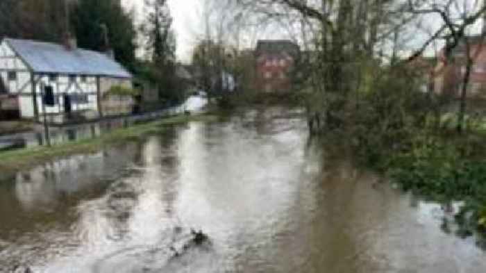 Road flooded due to river bursting banks