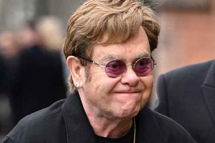 Sir Elton John shares 'devastating' health update as he's supported by husband