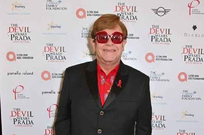 Sir Elton John tells fans 'I've lost my eyesight' as he's led off stage by husband David Furnish