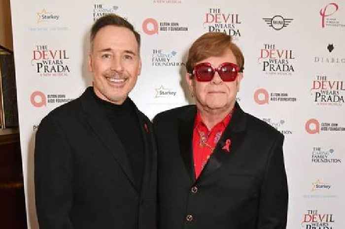 Sir Elton John makes rare health admission as he's led off stage by husband David Furnish