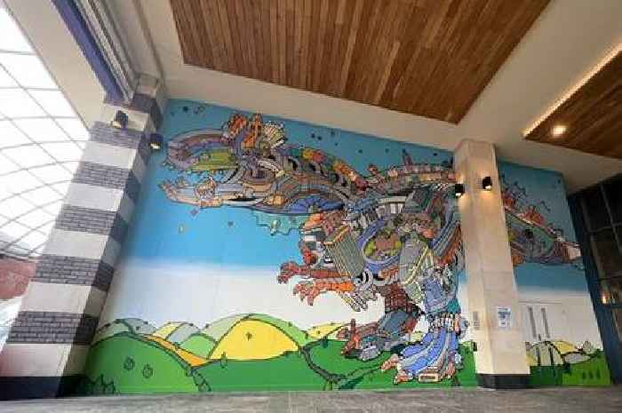 Bristol dinosaur artist unveils huge Cabot Circus mural to mark 20 years of groundbreaking work