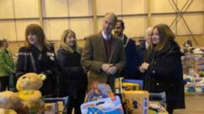 Prince Edward helps pack Christmas gifts during NI visit