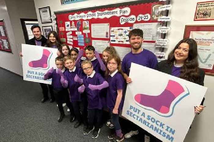 Youngsters from Cambuslang school pull on purple and urge others to put a sock in it