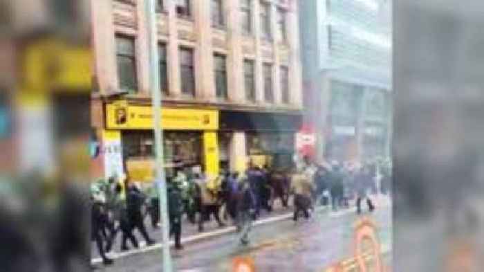 Football fans throw missiles in pre-match violence