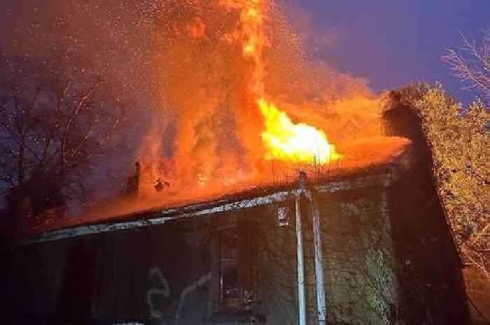 Dramatic photos show crews battling fire at property