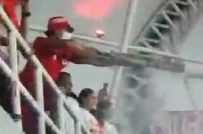 Football hooligan shoots cops with 'fireworks cannon' as hundreds invade pitch