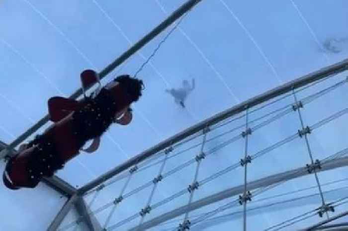 Shoppers look on with horror as man runs across glass roof of Scots shopping centre