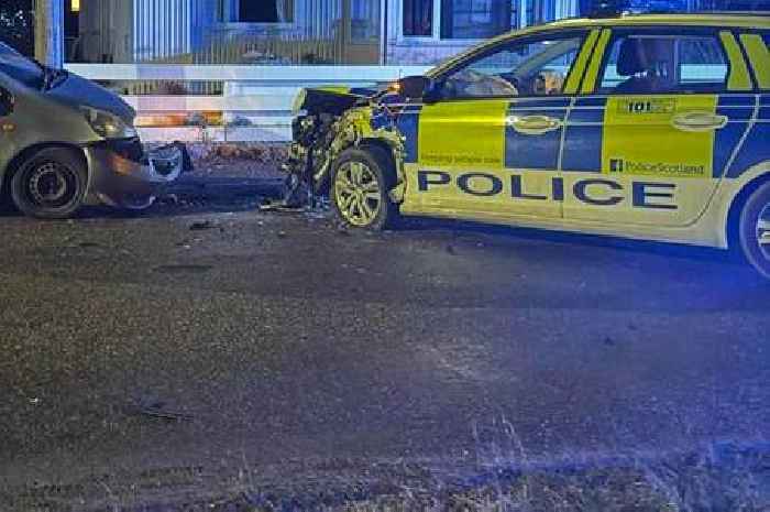 Road closed after police car involved in smash with another vehicle