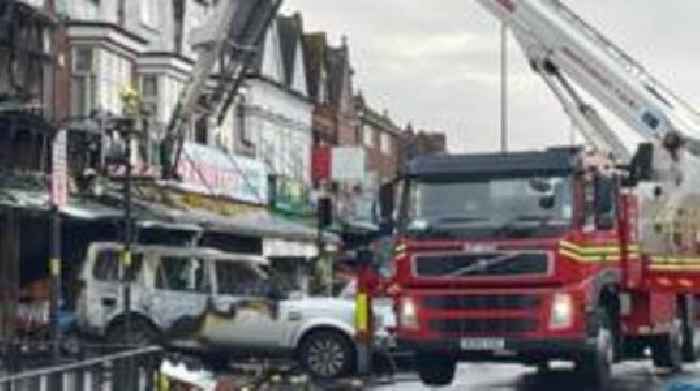 Arson probe after car hits shop before fire