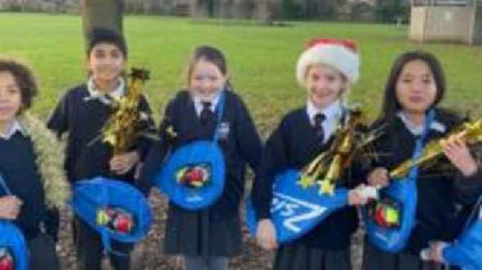 Tim Henman charity gives tennis rackets to pupils