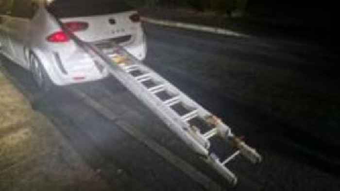 Police stop car with ladders sticking out of boot