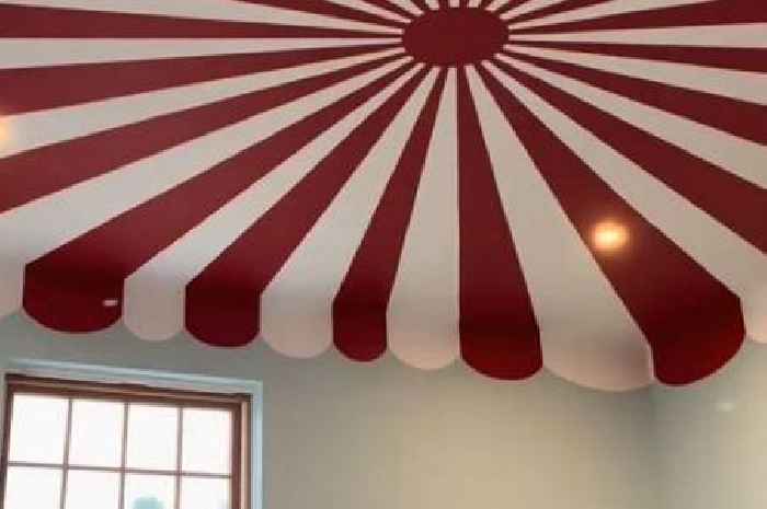 Nursery transformed into enchanting circus tent-themed playroom