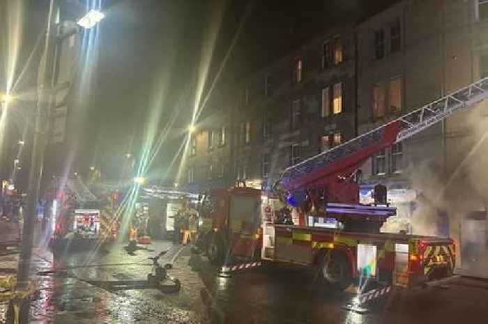 Stark images show huge response as fire crews battle blaze at Scots shop