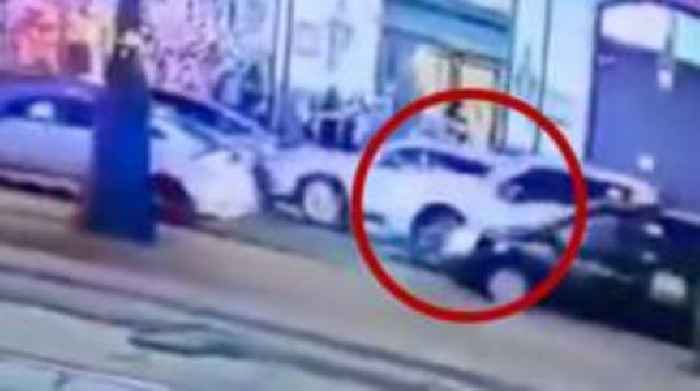 Moment pick-up truck enters busy street on New Year's Day