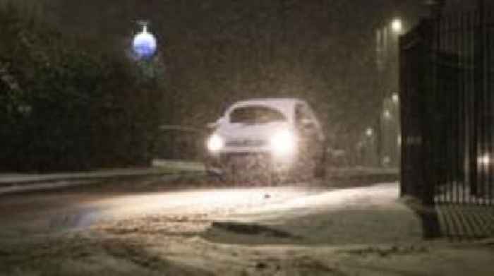 Snow and freezing rain sweep UK with amber warnings in place