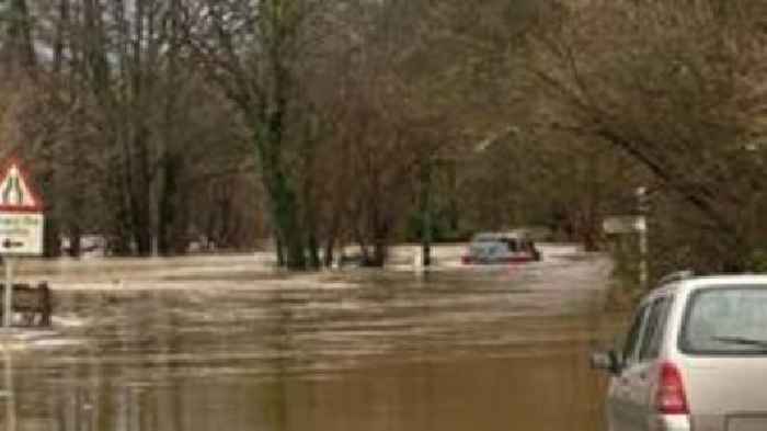 Elderly couple rescued after car trapped in flood