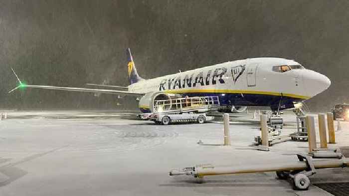 Heavy snow warnings cover much of UK as airports close runways