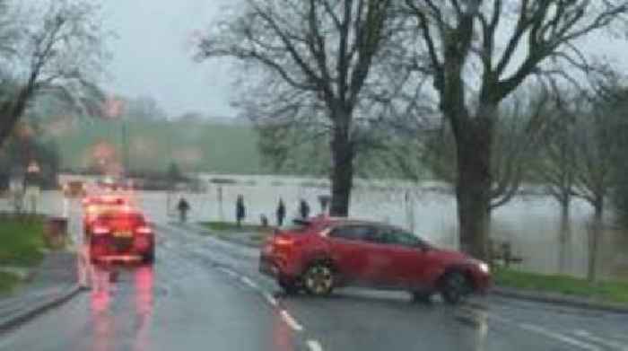 Flood warnings and roads closed after heavy rain